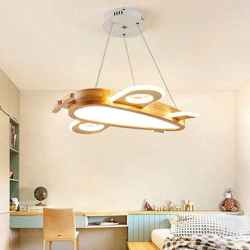 Airplane pendant above a wood desk, green-front storage and a bed with checked bedding