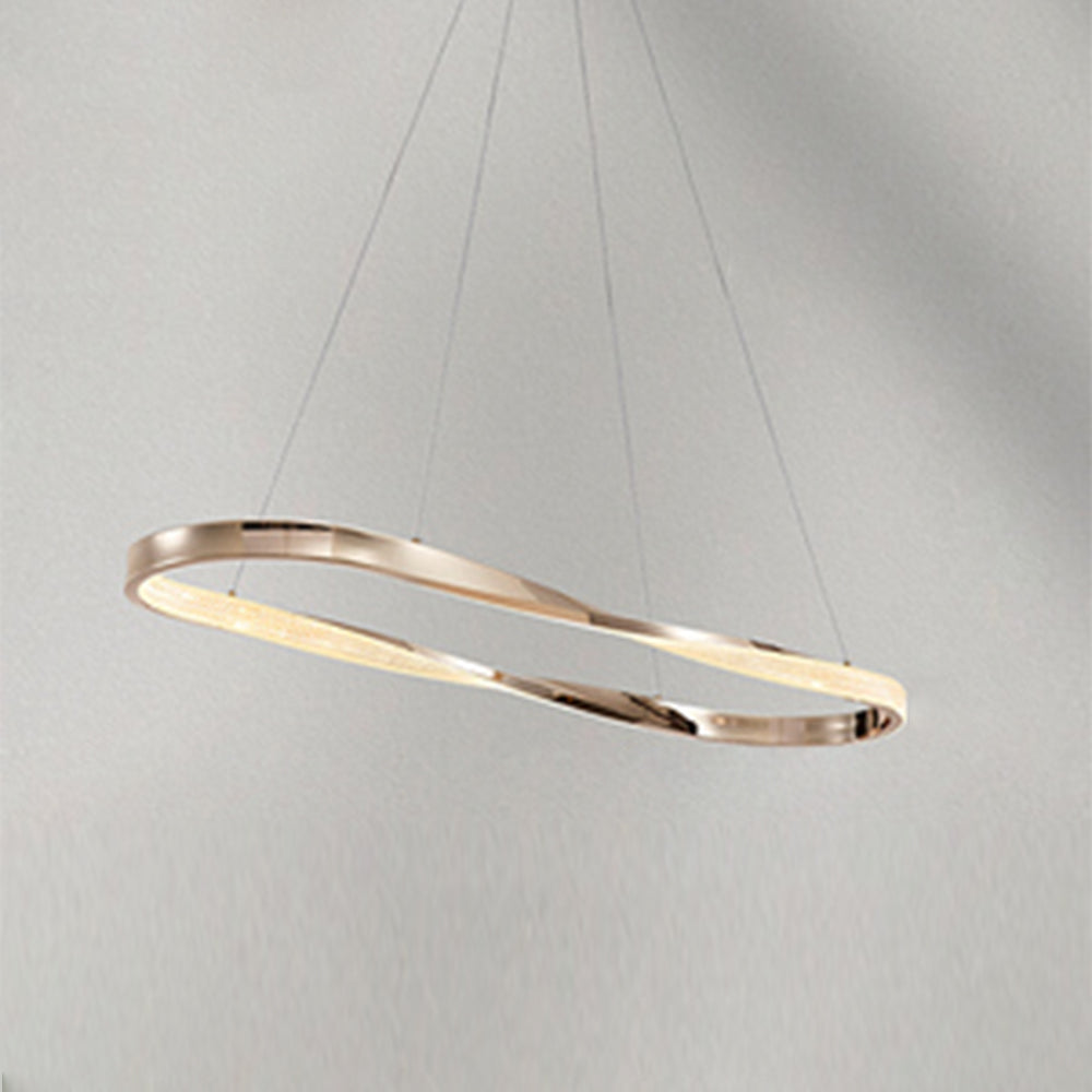Copper-finish Kirsten oval pendant viewed at an angle, with illuminated acrylic band and thin wires against pale wall