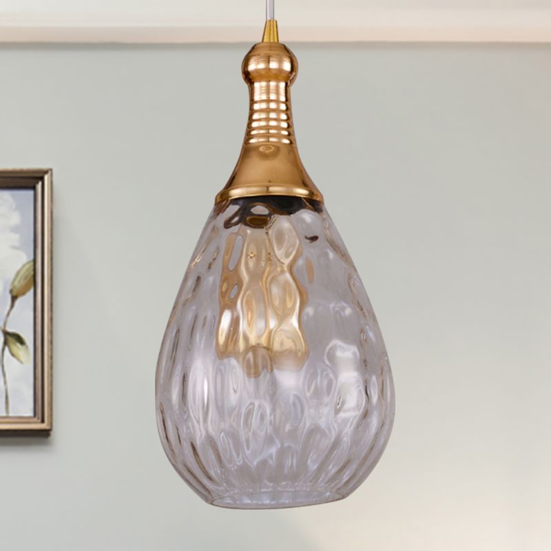 Avi Brass-Clear teardrop glass pendant with a textured shade