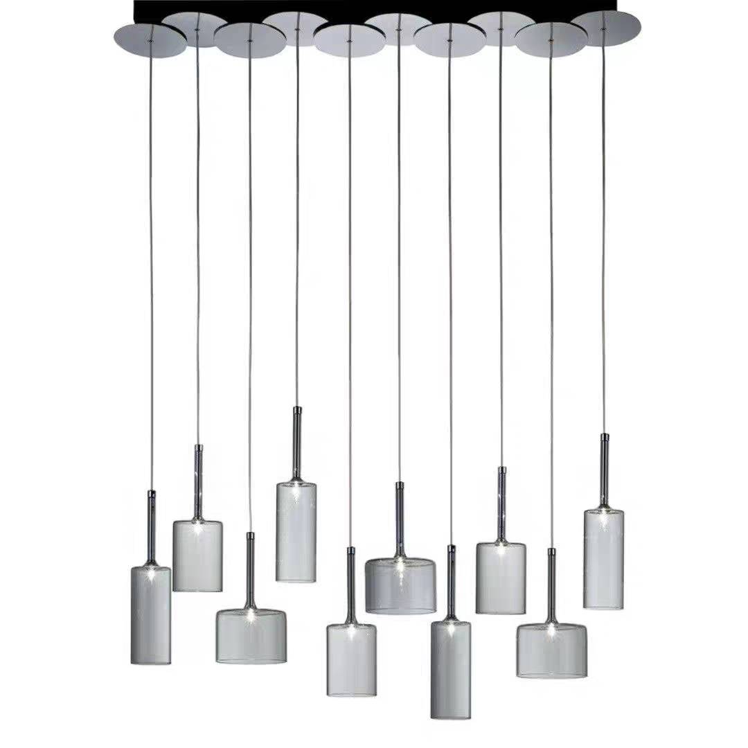 Ten-light Kristy cluster with staggered clear shades below a long dark canopy.