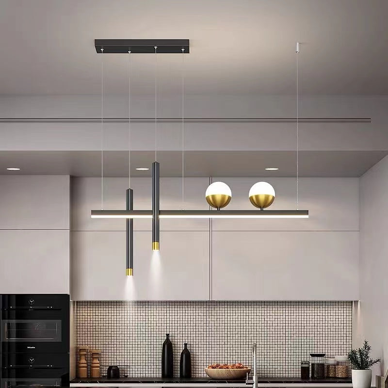 Madina two-globe pendant above a kitchen counter.