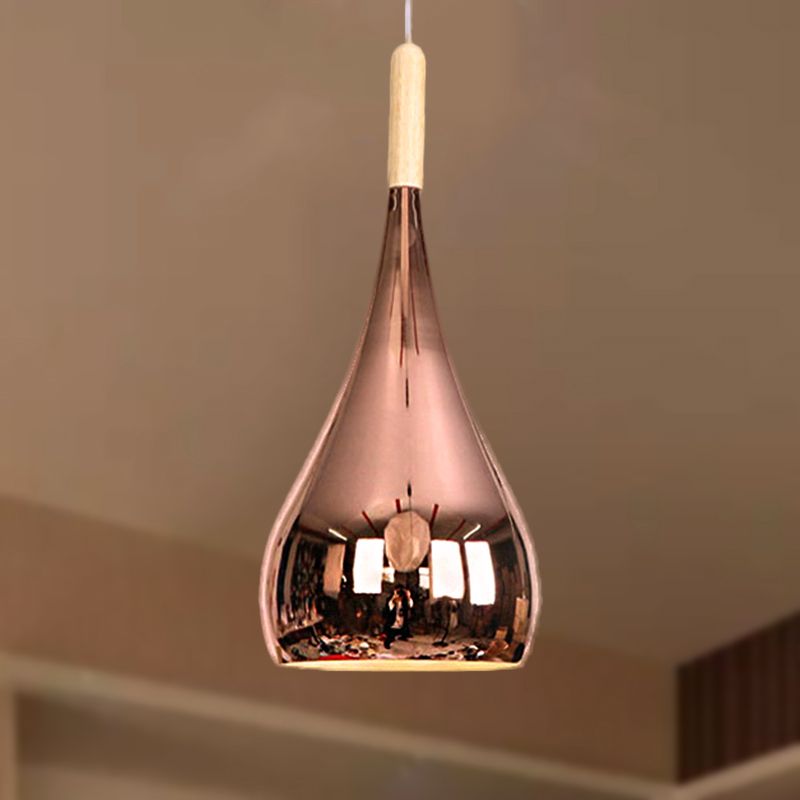 Avi Rose Gold pendant showing its curved teardrop profile