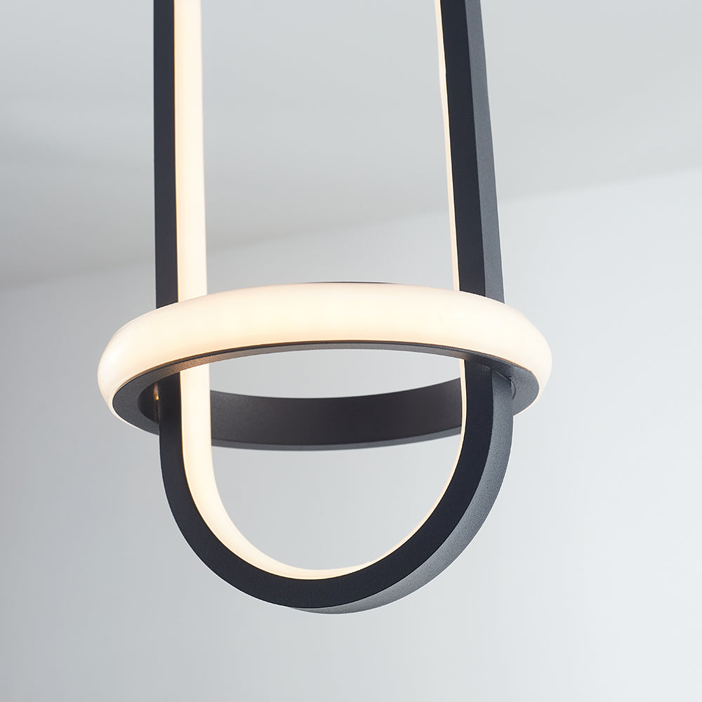 Close black Nyla oval frame and white illuminated inner strip crossing a bright horizontal ring