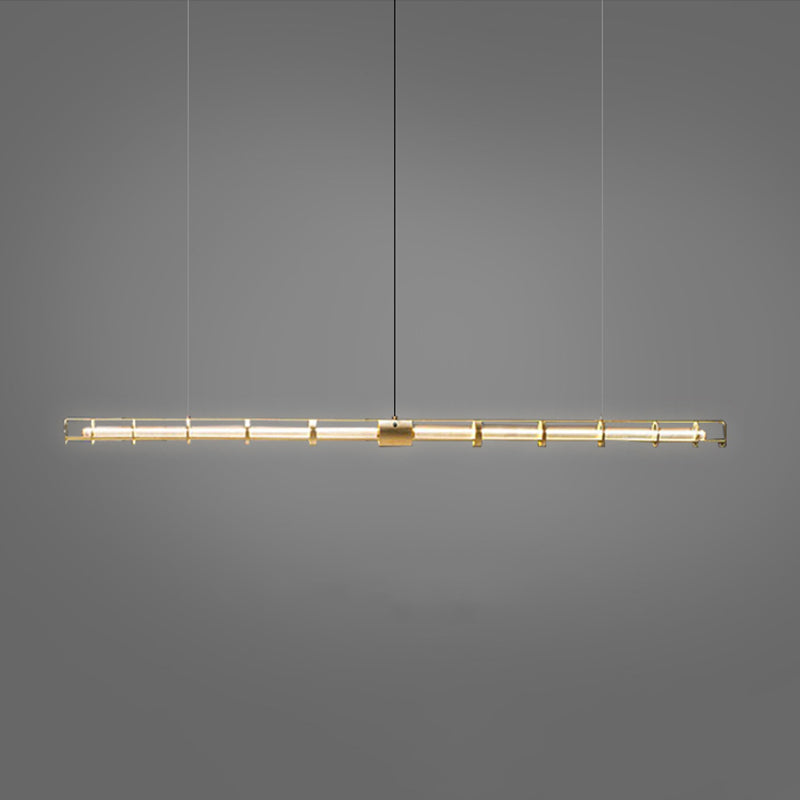 Edge gold-tone ring-frame tube lit against a dark gray background with fine suspension wires and a central black cable