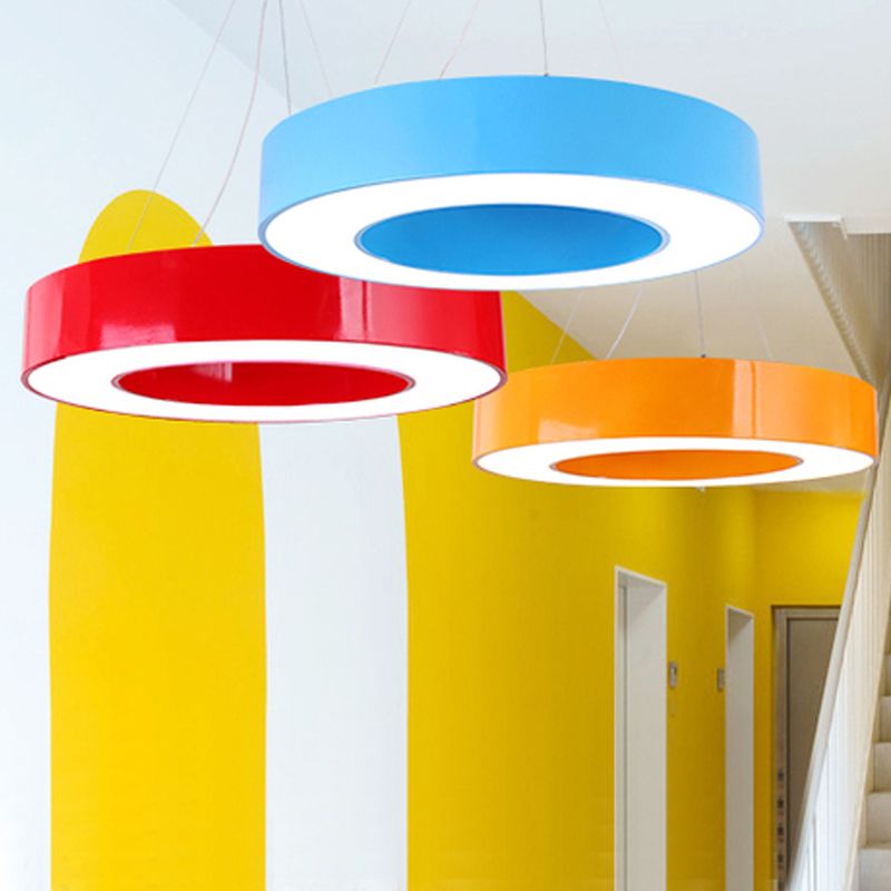 Blue, red and orange-looking rings suspended in bright interior