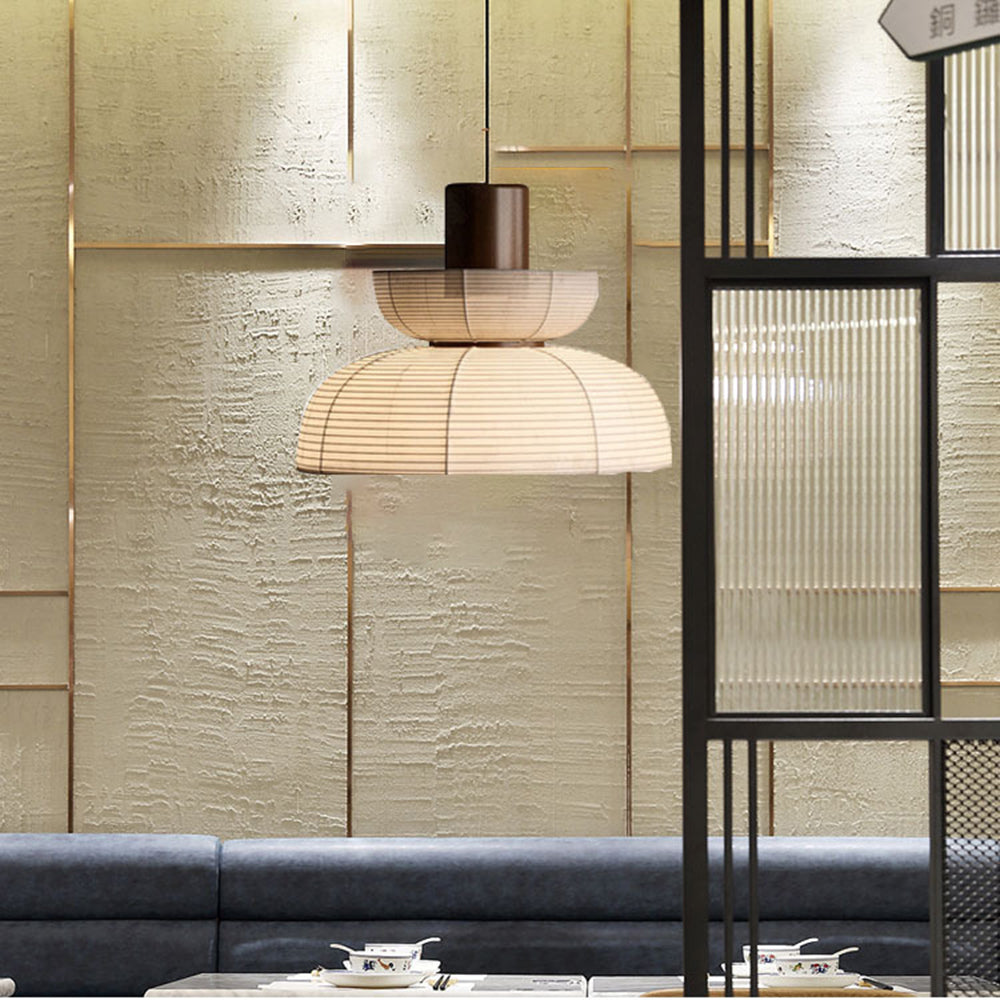 Ozawa pendant with an upturned upper bowl and lower dome above a sofa