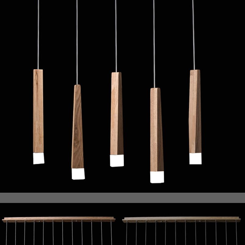 Ozawa wood column pendants arranged on a black background, with two long ceiling-bar examples pictured below.