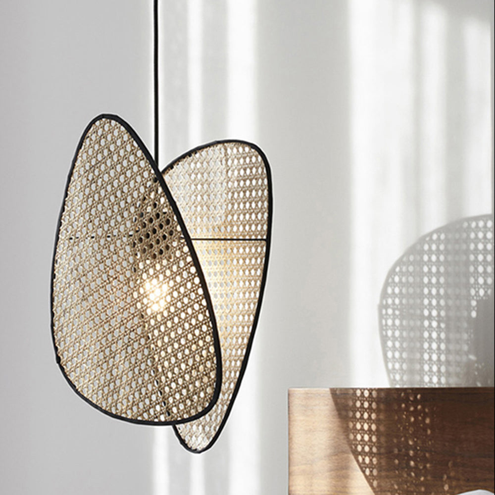 Lit Ritta woven panels near a window, casting patterned shadows on the wall.