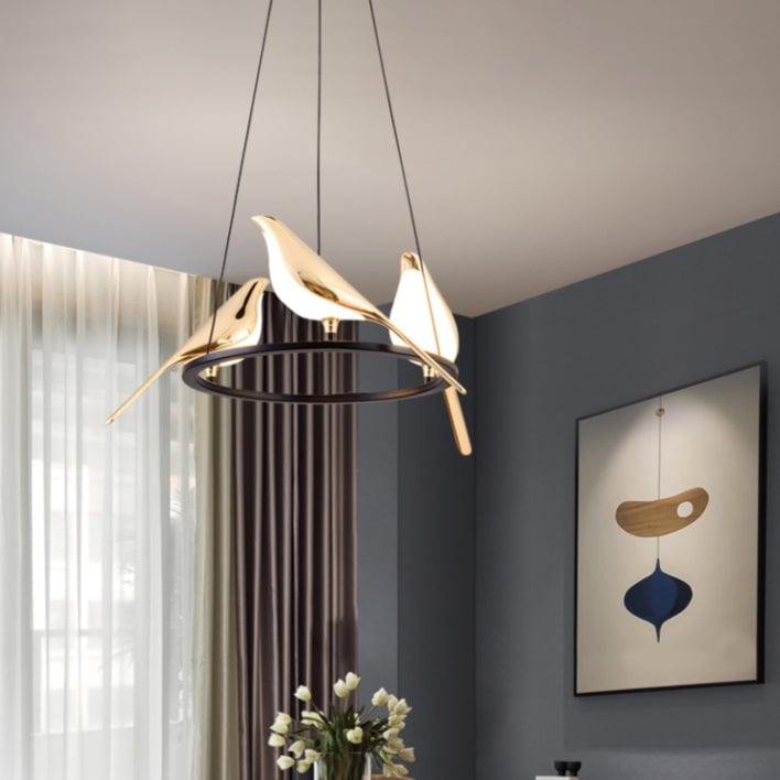 Three-bird ring pendant above room table