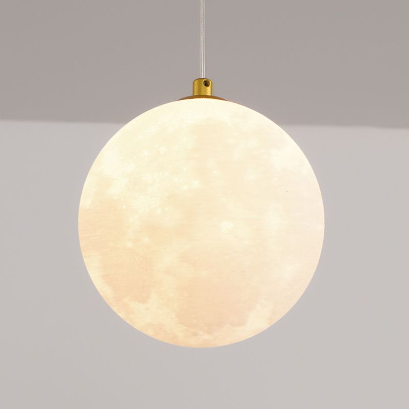 Close view of the pale illuminated hanging globe