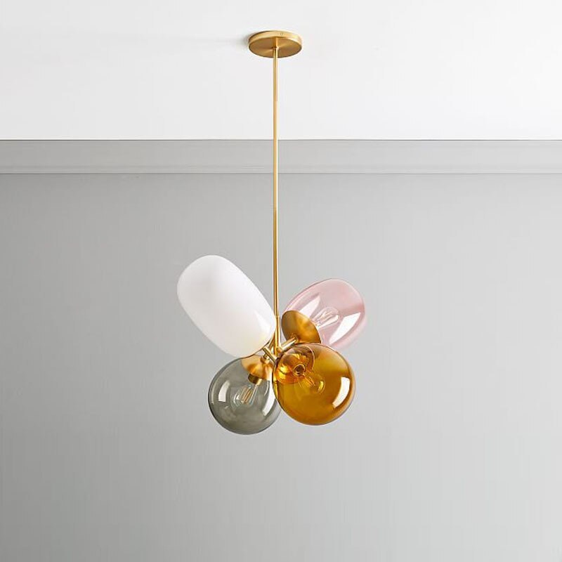 Morandi four-shade cluster suspended from a gold-tone ceiling canopy.