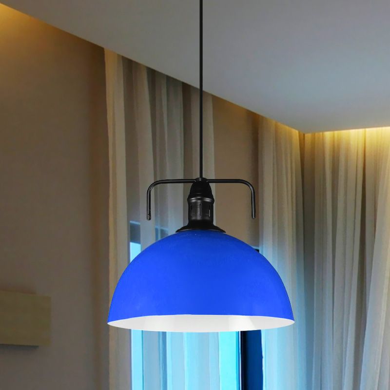 Dark blue pendant beside curtains