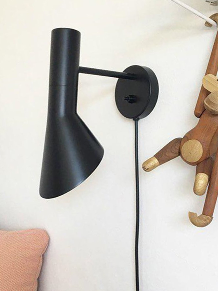Calix black cone shade with a short arm, round wall plate and hanging cable