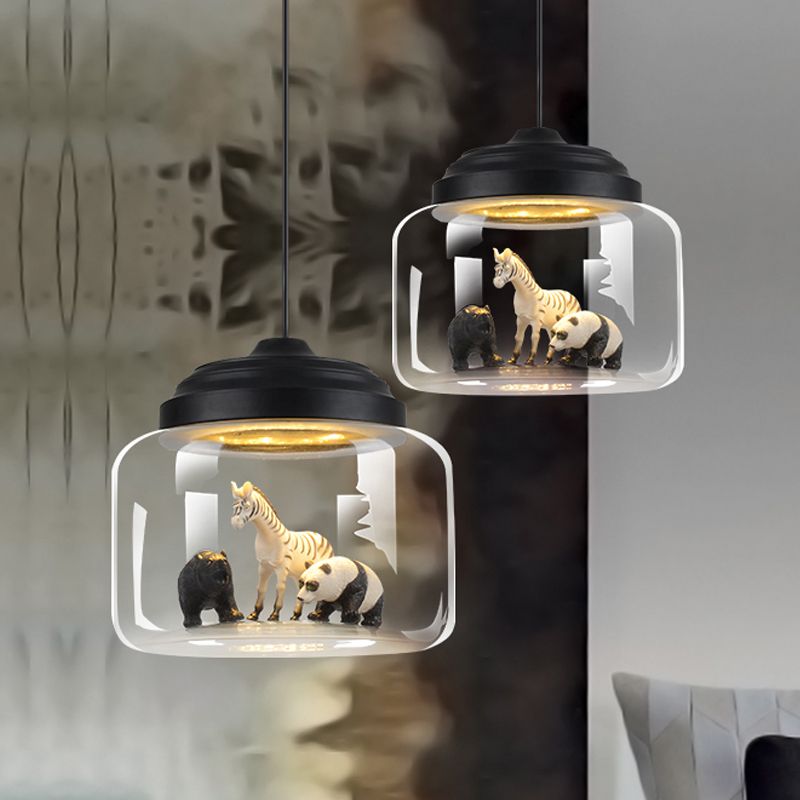 Two Leilani Black animal pendants pictured beside bedroom furnishings