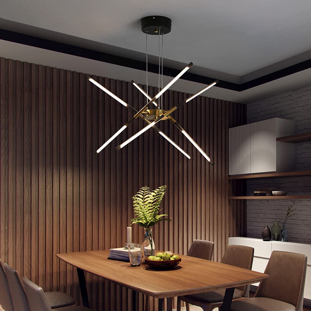 Black and Gold eight-head crossed rods above wood dining table, fruit bowl and fern against wood slat wall