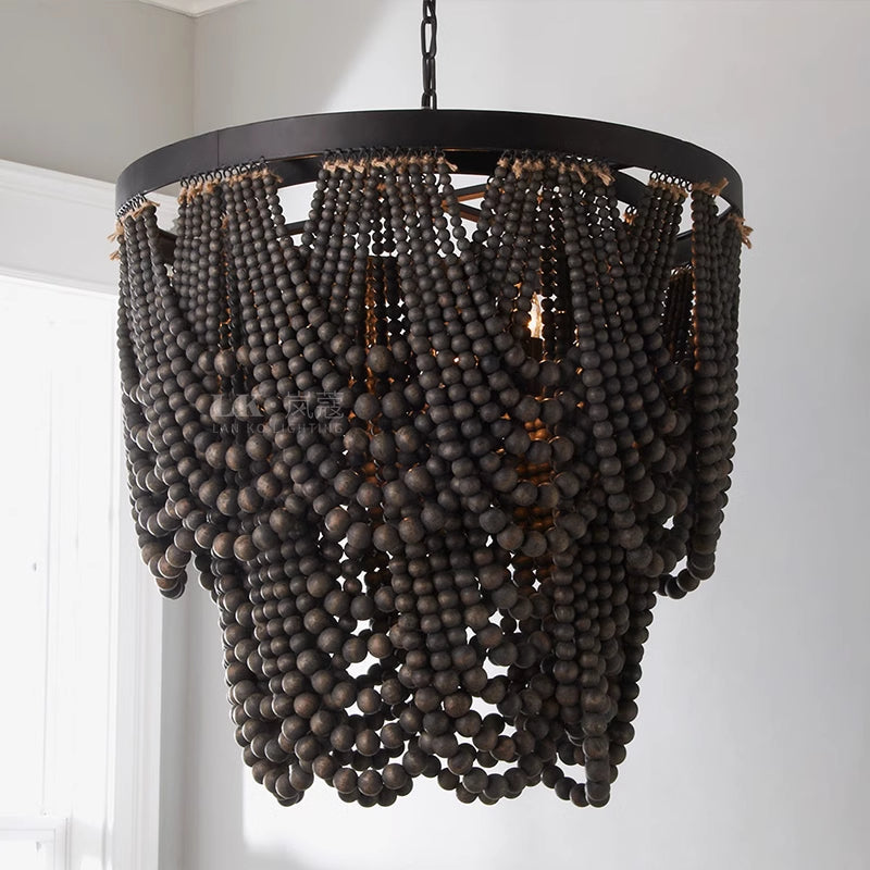 Black beaded pendant near a bright window