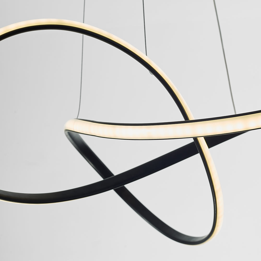 Crossing black Louise loops with illuminated inner edges.