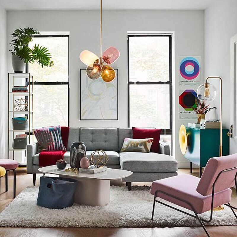 Colourful Morandi balloon pendant in a living room with a pink chair.
