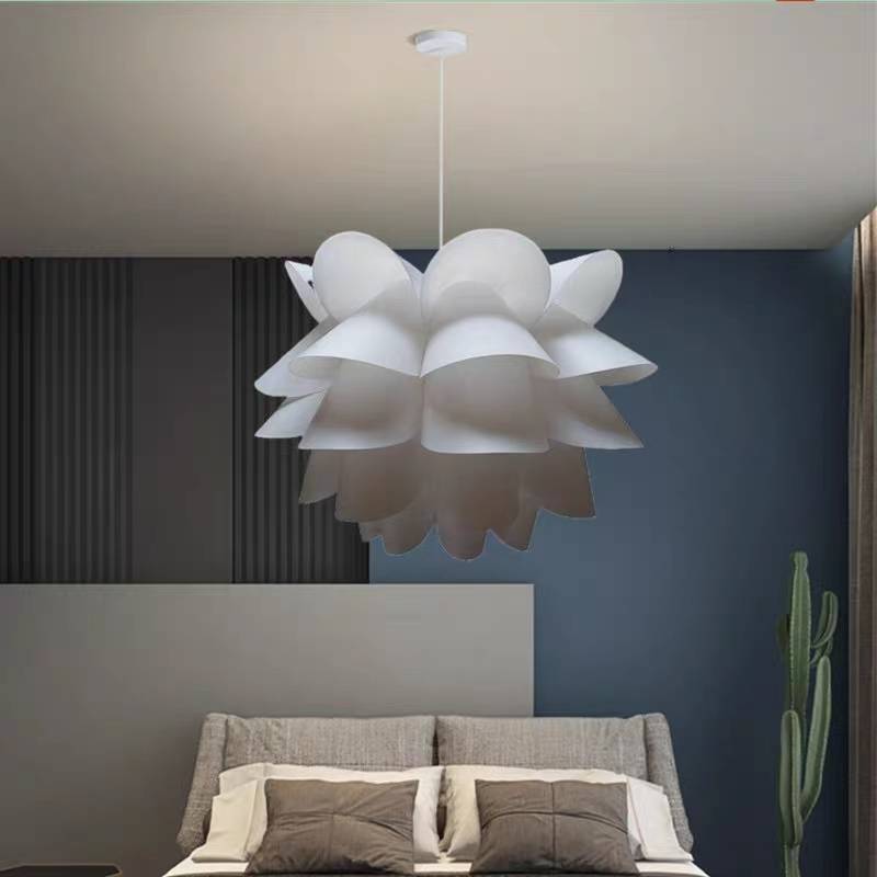Cairns white flower pendant pictured above a bed
