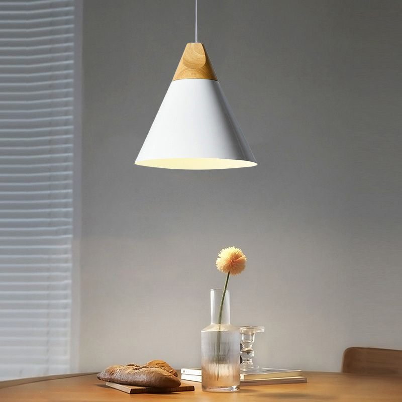 White broad cone pendant above a wood table with bread, flower and glass vase