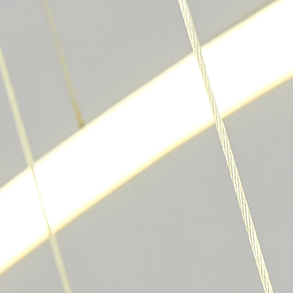 Arisha illuminated diffuser strip behind a thin suspension wire