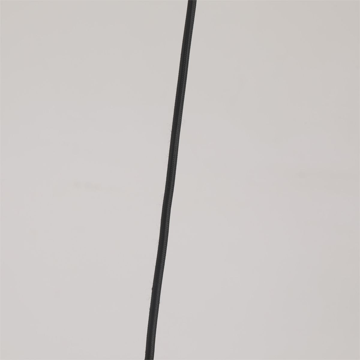 Closeup of Morandi’s black braided suspension cable against a plain gray background