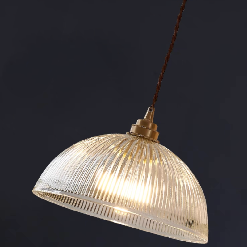 Angled close view of the lit Alessio ribbed glass shade