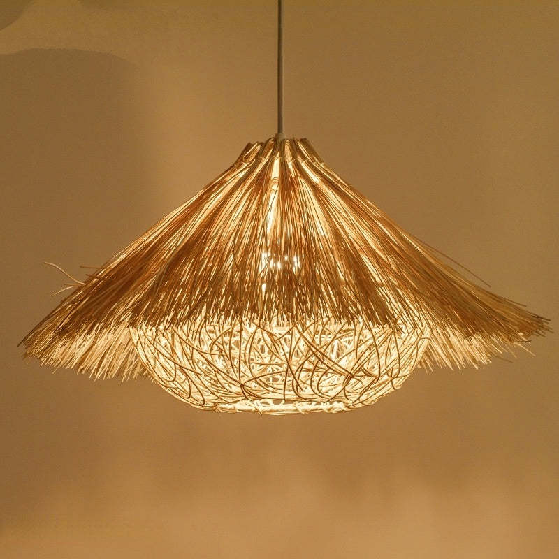 Brown-option Muto pendant with a fringed shade and glowing open-weave underside.