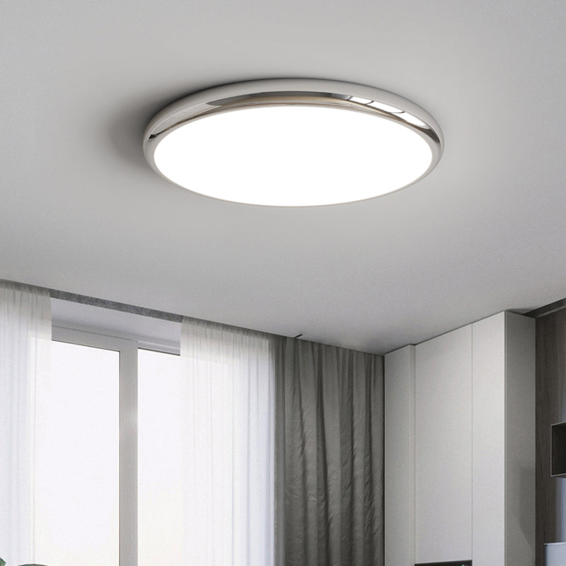 Ozawa round silver-tone ceiling light near tall windows