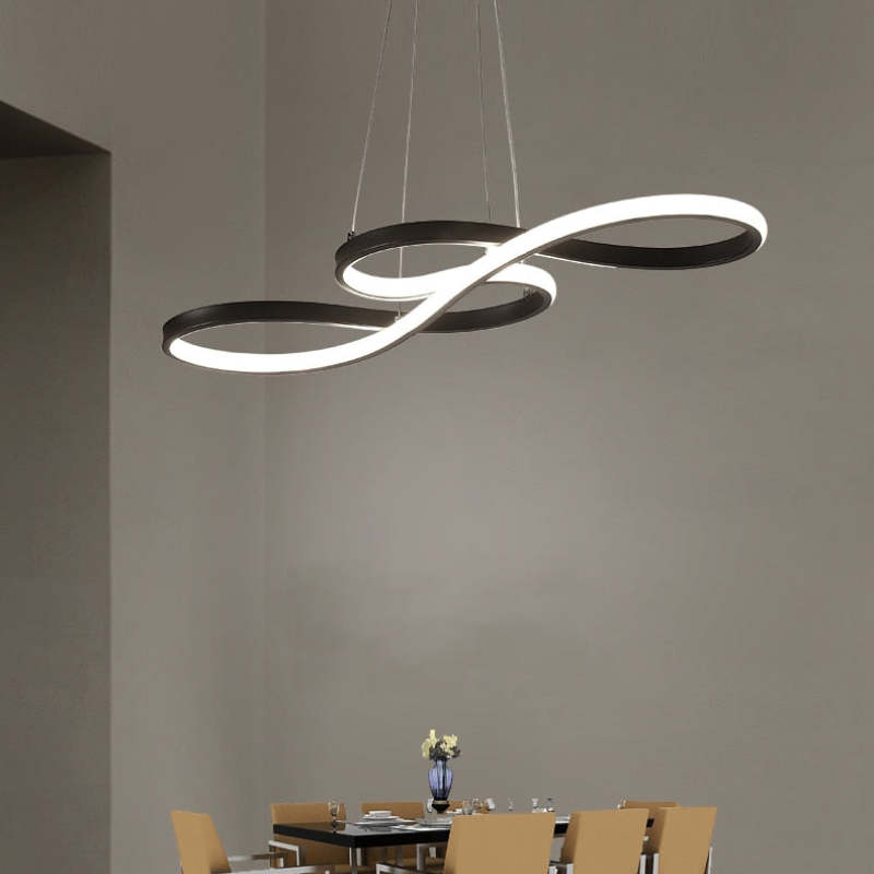 Black figure-eight light above a small dining table