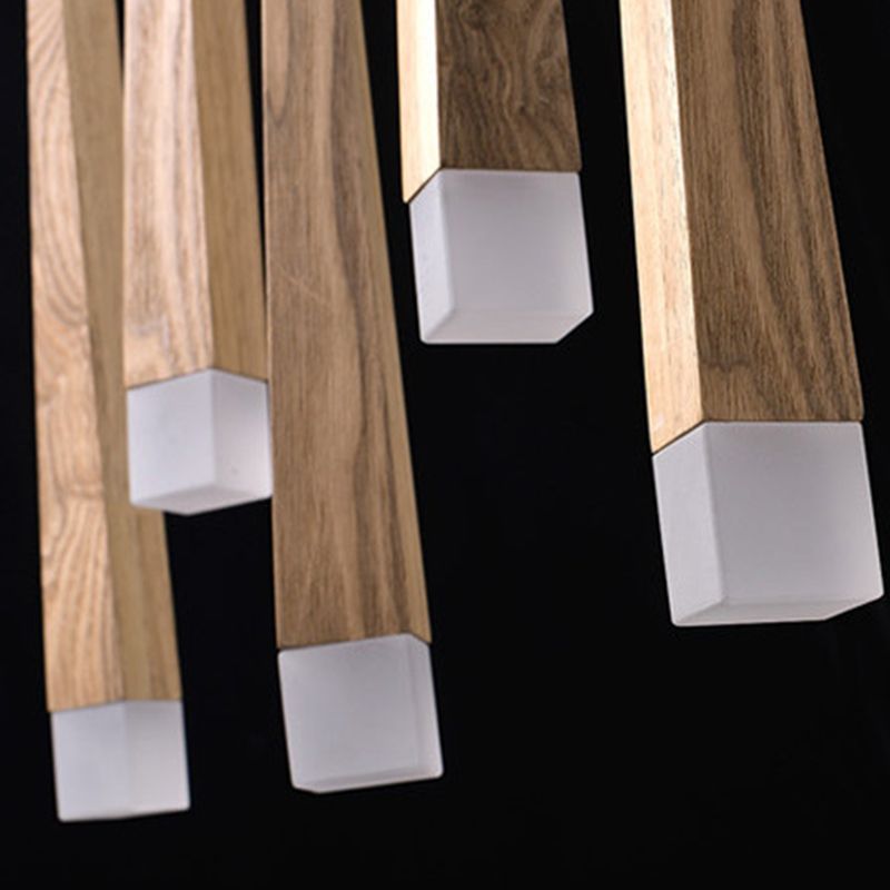 Close-up of Ozawa wood-grain faces and square white acrylic tips against a black background.
