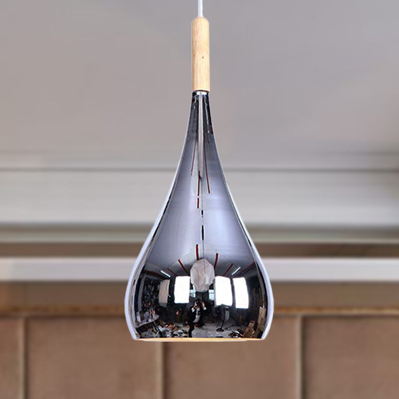Avi Chrome mirrored pendant with pale upper neck in an interior