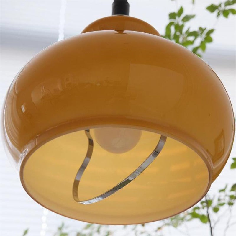 Underside view of orange glass dome and inner light
