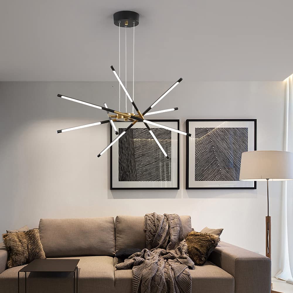 Black and Gold Edge above taupe sofa with textured pillows and throw, paired patterned prints and cream floor lamp