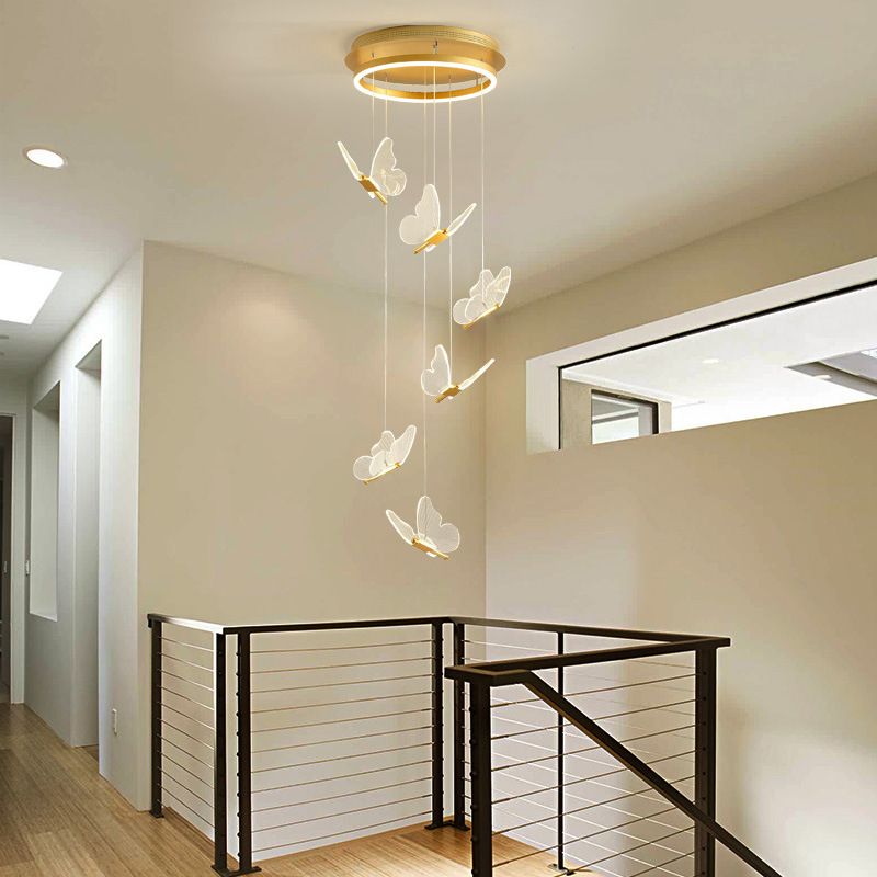 Six butterfly pendant lights above an indoor stair landing