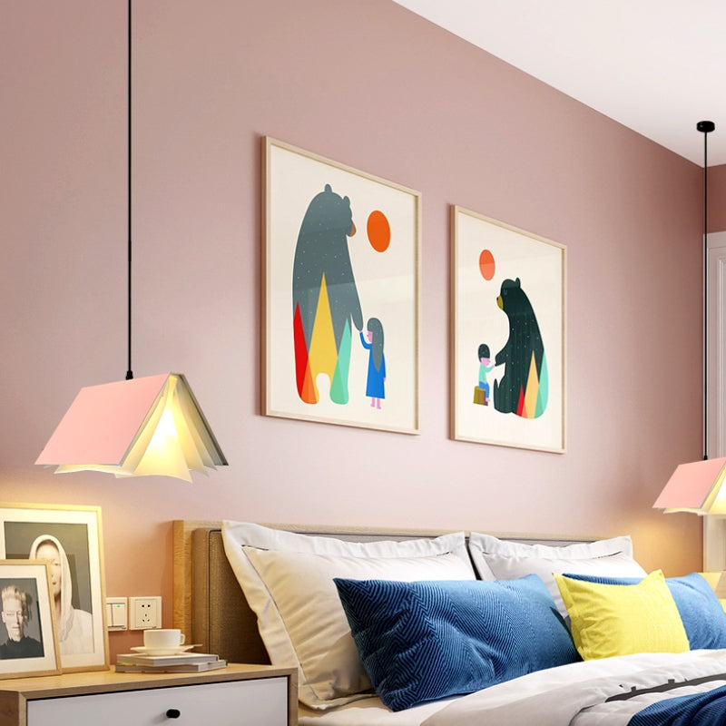 Pink book pendant above a bedside space