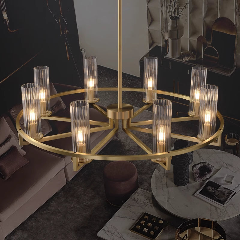 Illuminated ribbed glass cylinders around gold-tone ring close view