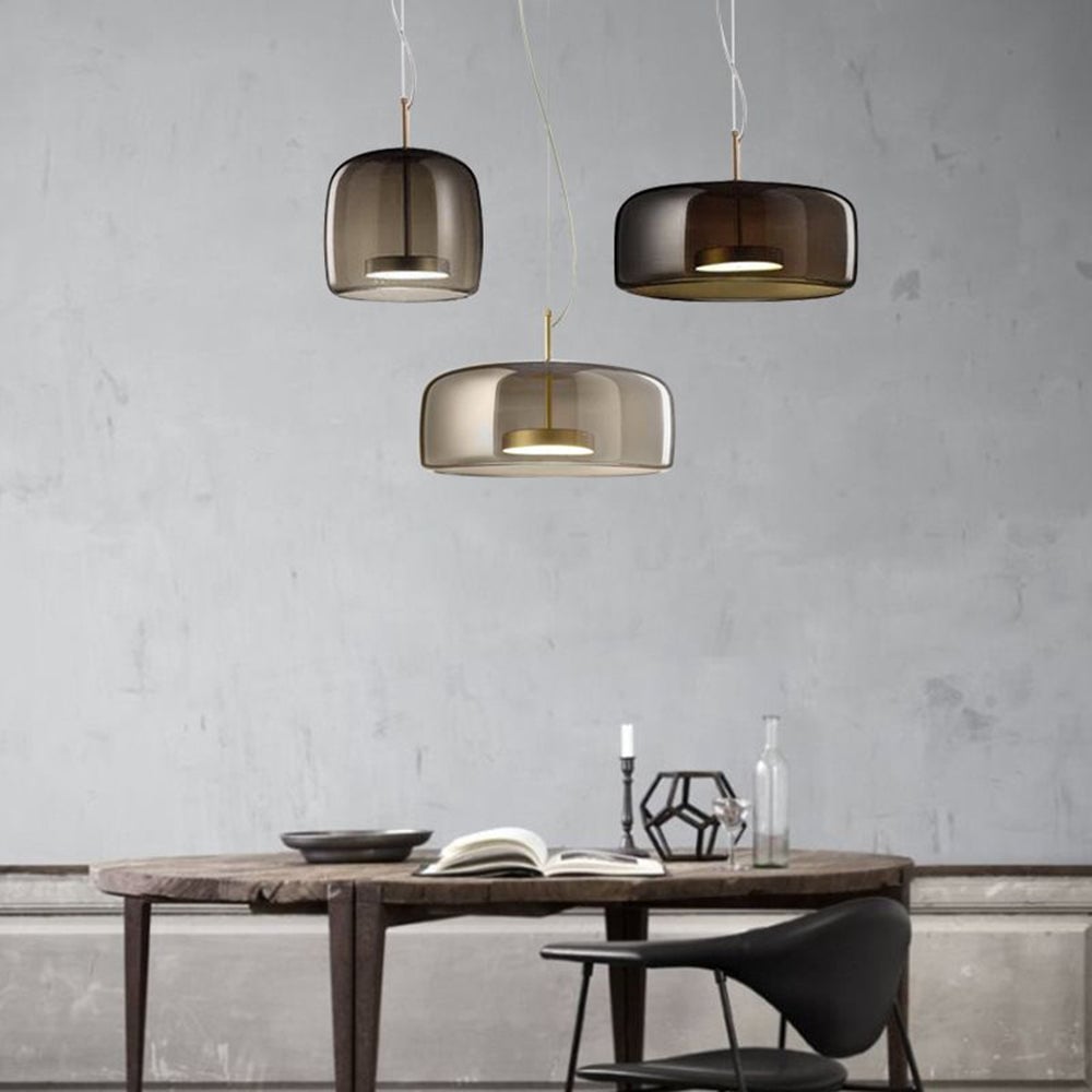 Hailie glass pendants in mixed proportions above a long table
