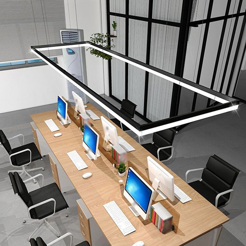 Several Edge light bars arranged above shared office desks.