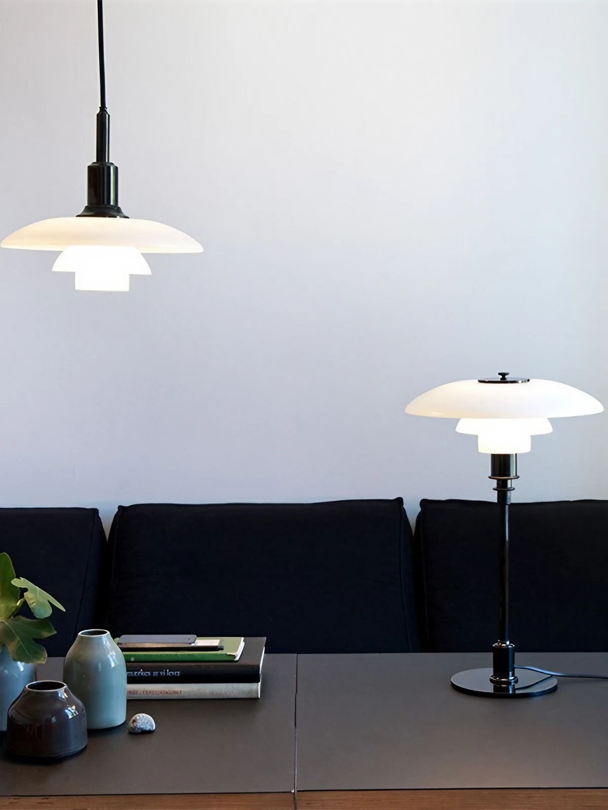 Opal disc pendant and a separate table lamp in a living room