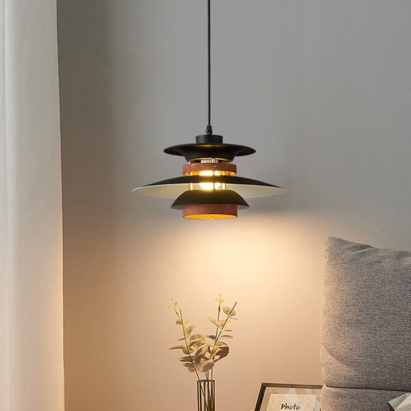Single black and wood-look layered pendant by side table