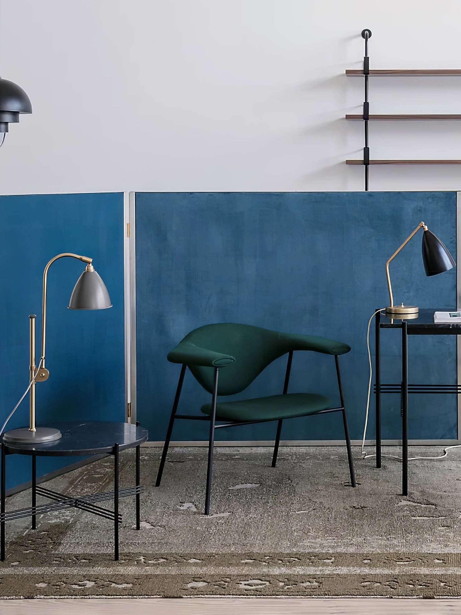 Blue metal pendant in an office seating area