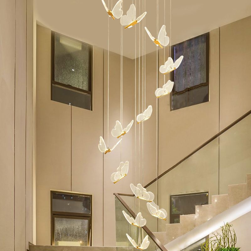 Cascading acrylic butterfly pendant beside curved staircase