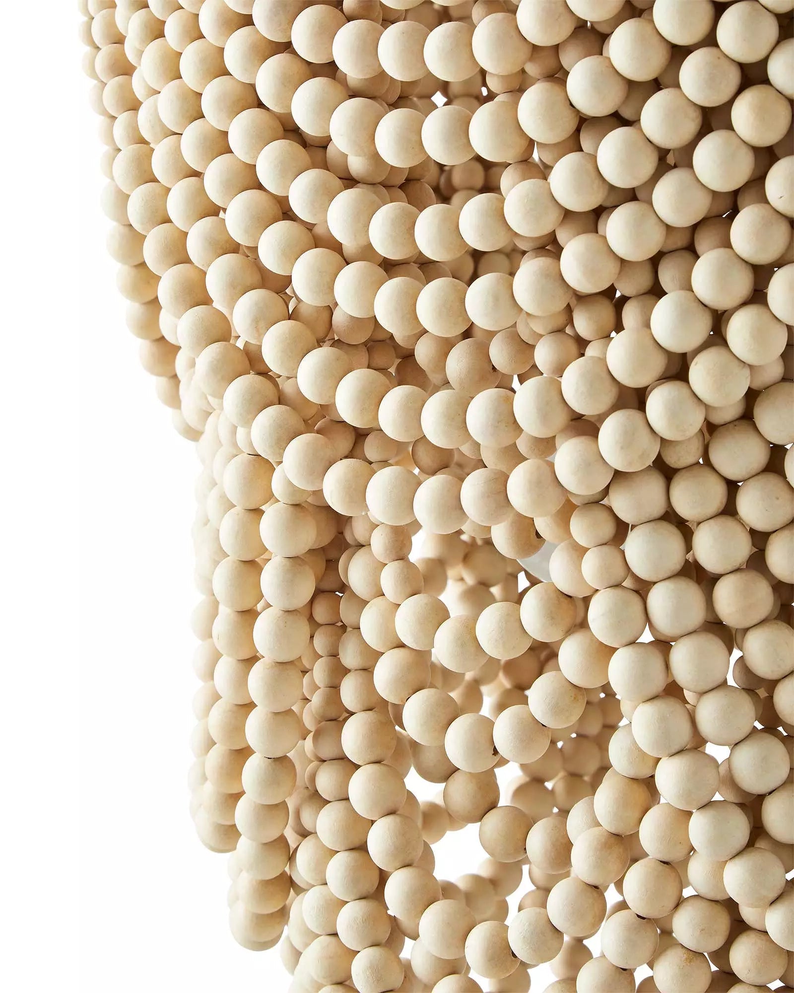 Close view of pale round wooden bead strings