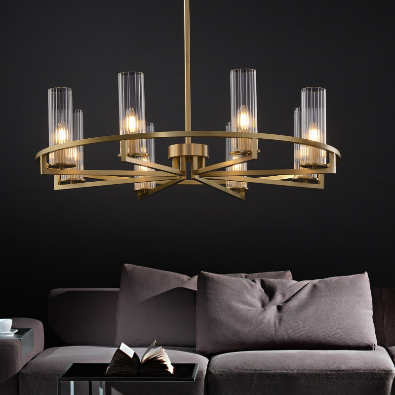 Six-head glass ring pendant above dark sofa