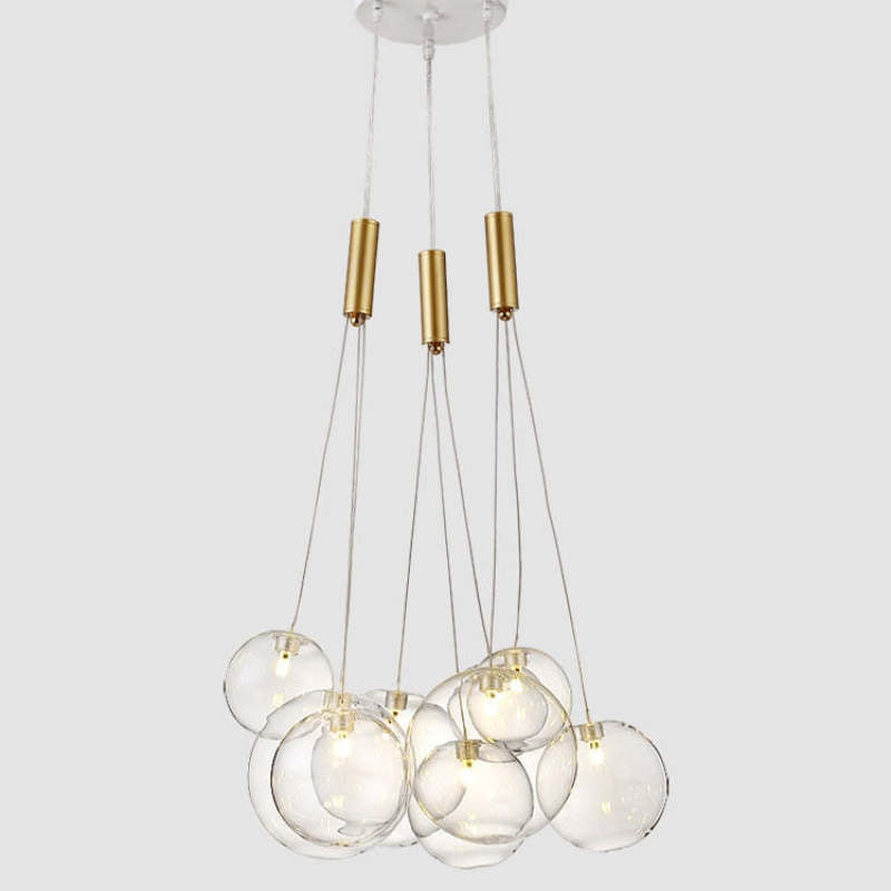 Valentina Transparent 9-bubble pendant on pale gray, with a white canopy and three gold-tone cylindrical fittings