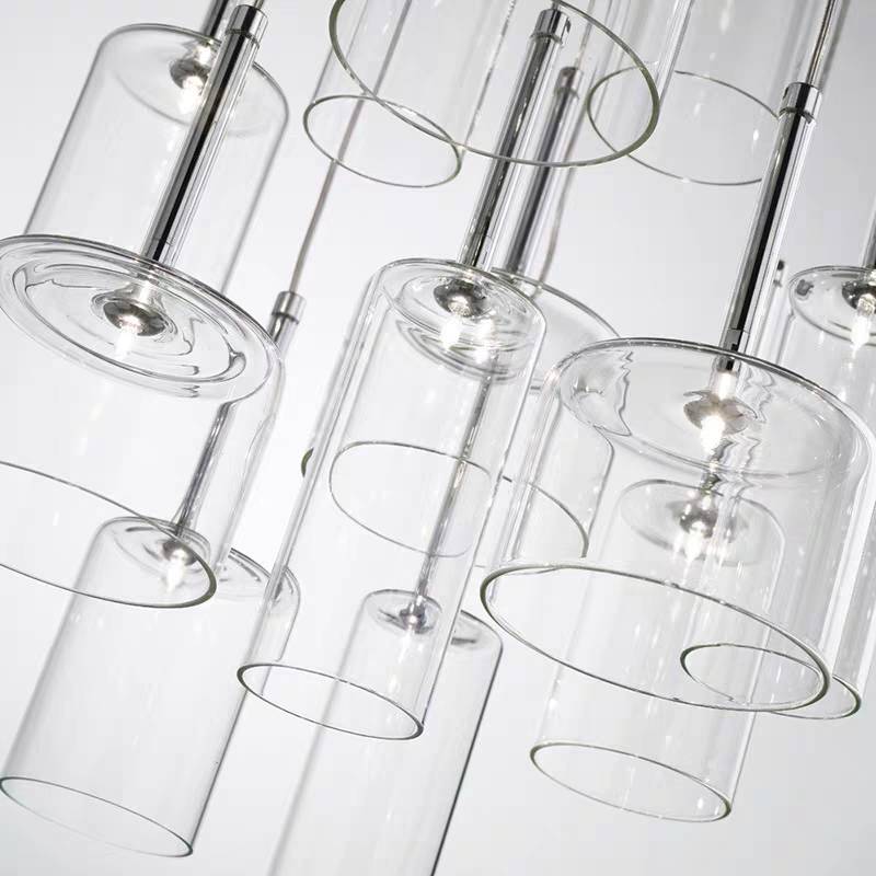 Close view of Kristy clear glass cylinders, circular edges and slim metal fittings.