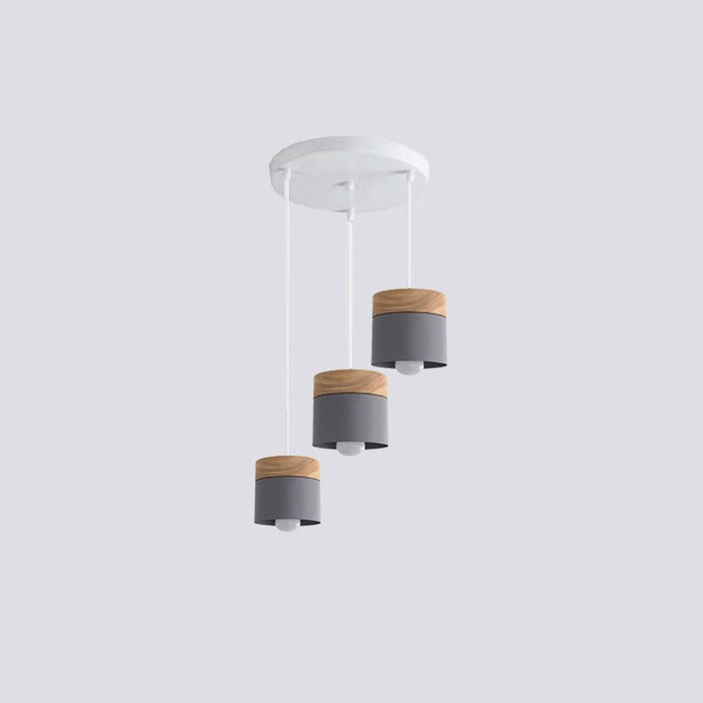 Three gray wood-accent cylindrical heads at staggered heights below a white round canopy