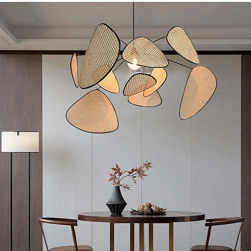 Ritta rattan leaf pendant above a small round dining table