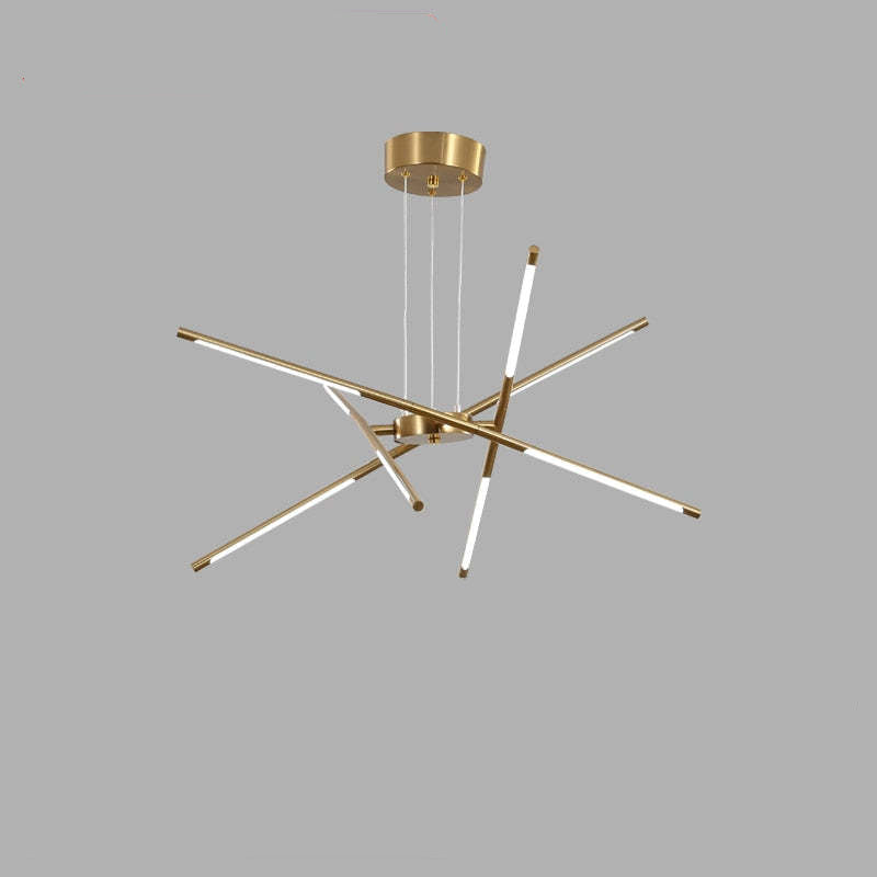 Gold eight-head Edge pendant with four crossed rods, one nearly vertical, suspended from a round canopy against grey